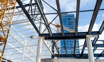 construction-site-with-steel-frame-structure-and-c-2024-10-18-08-31-20-utc_11zon.jpg